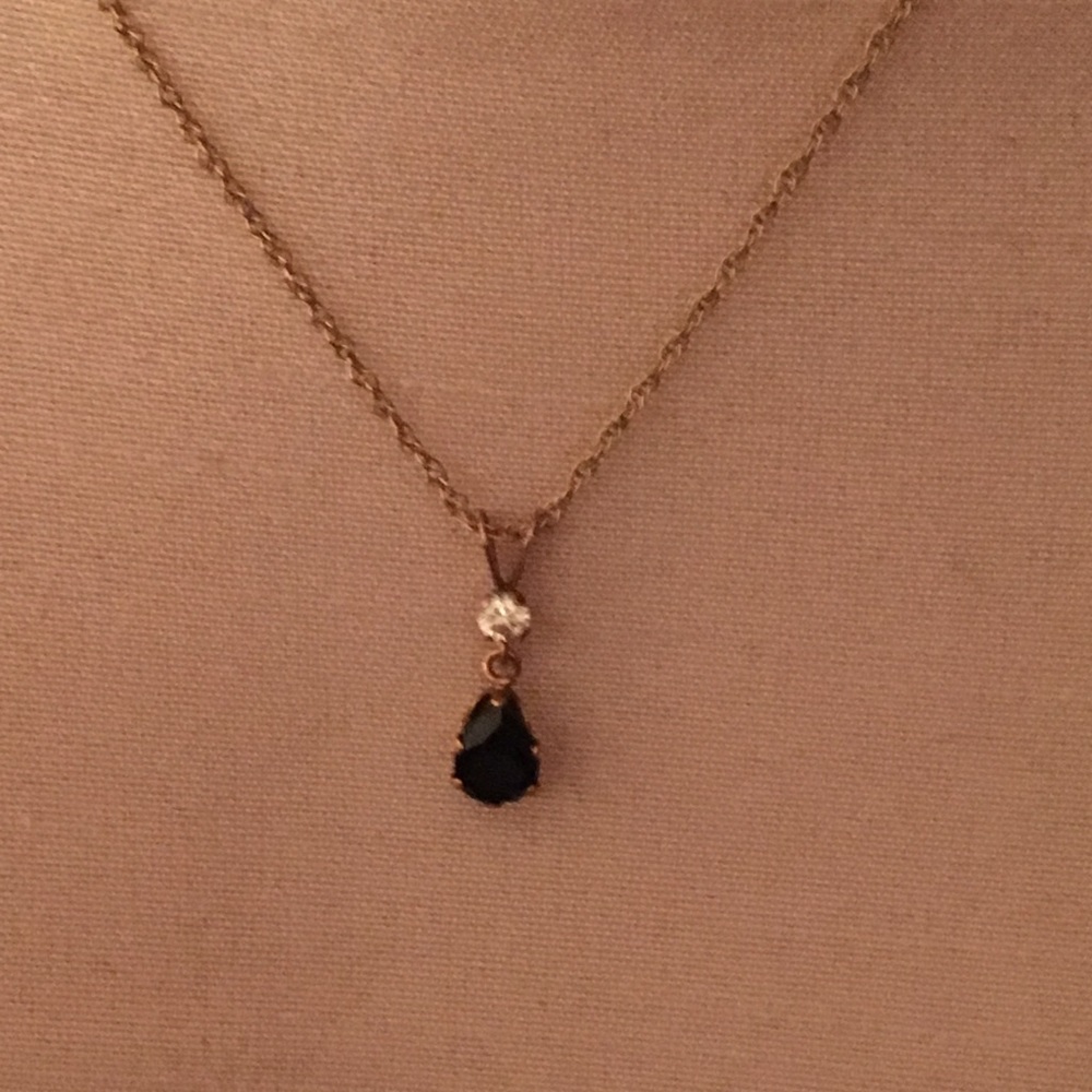 Gold necklace with diamond and blue stone